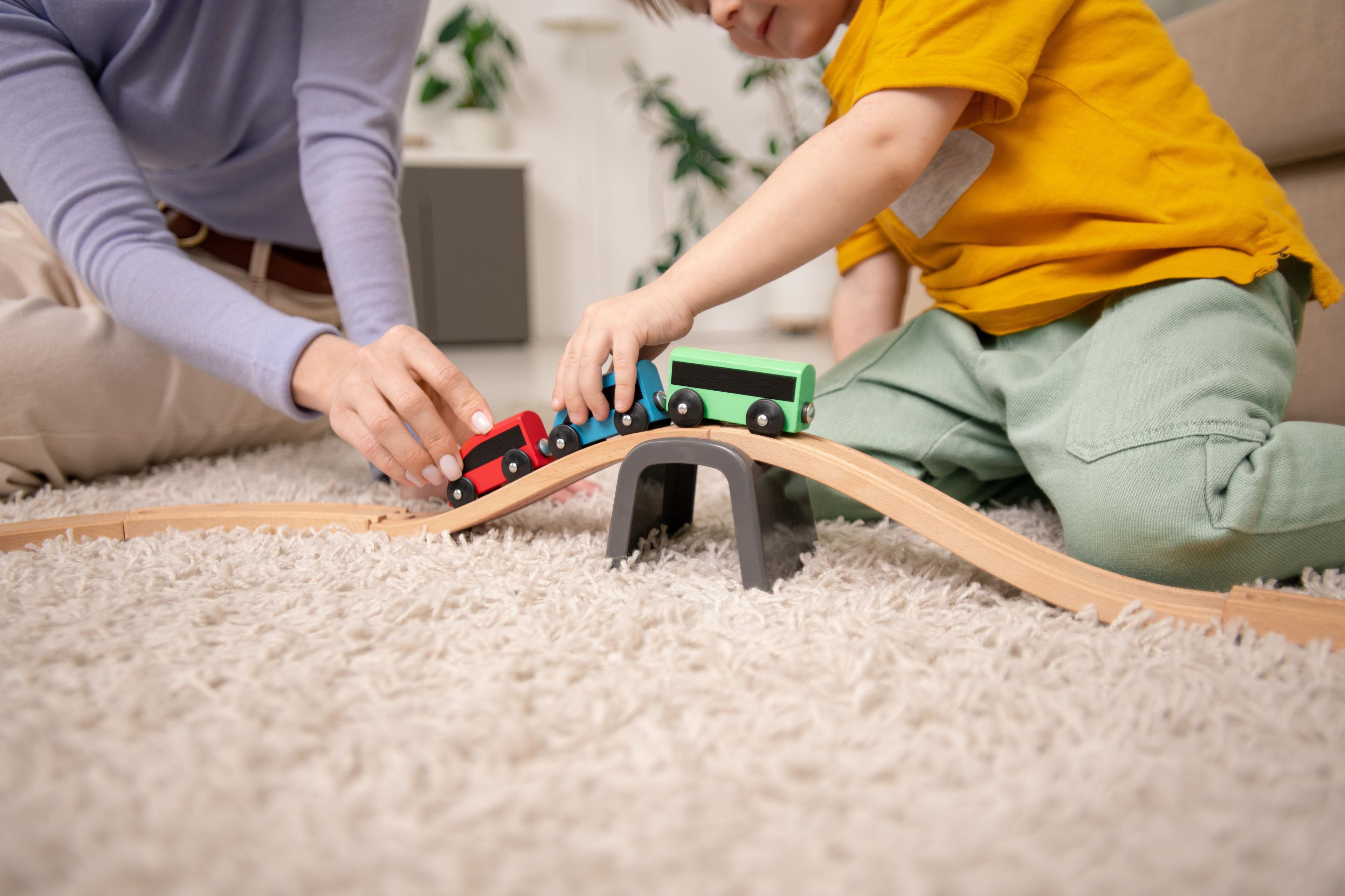 playing-with-toy-train-on-toy-railway-2021-09-24-03-15-36-utc.jpg